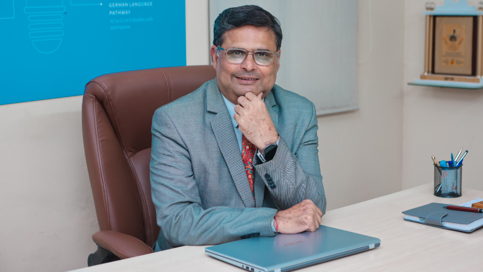 A professional headshot of Mr. Mukul Chimote, smiling confidently in formal attire.